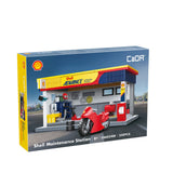 Boîte du kit station de maintenance en briques avec garage course et voiture monoplace rouge.